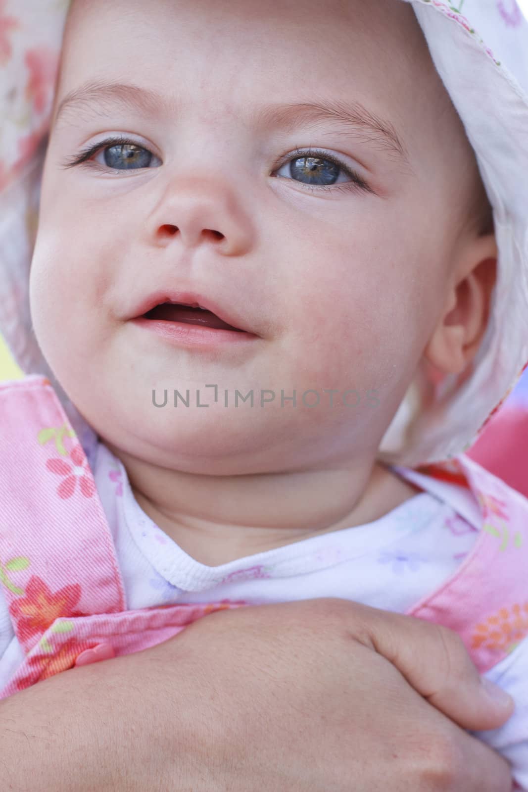 Smiling baby girl with blue eyes