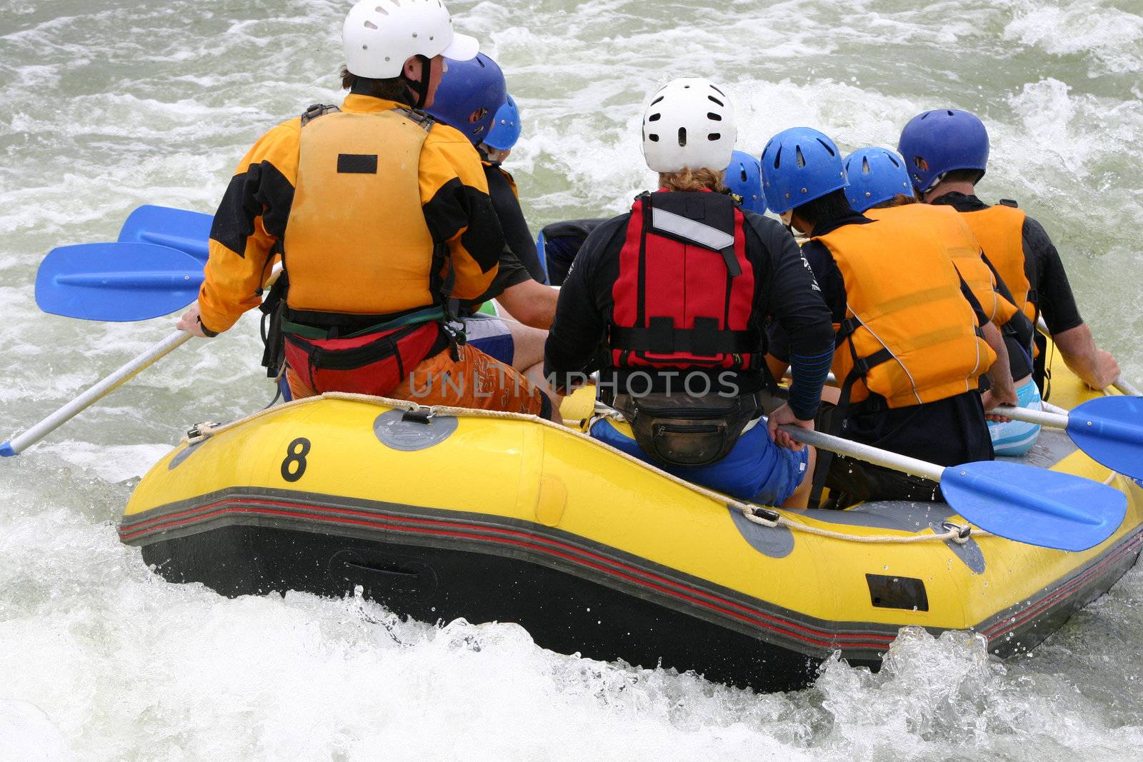 A group whitewater rafting