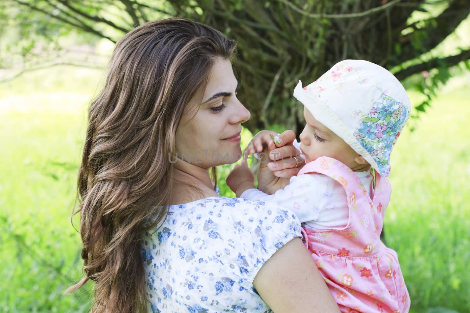 Baby girl with her mother by manaemedia