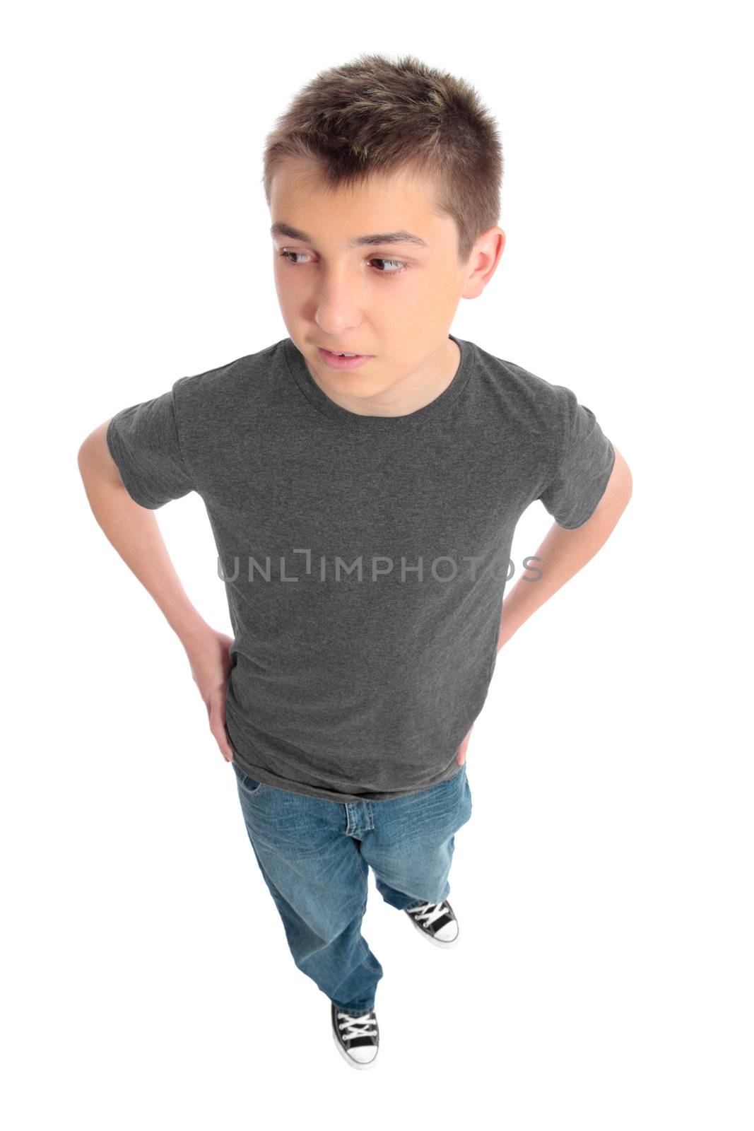 Boy in a grey t-shirt and blue jeans looking sideways