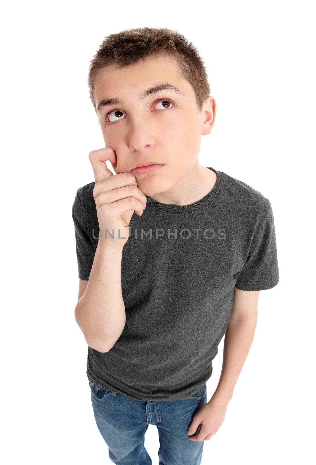 Boy with hand on face thinking