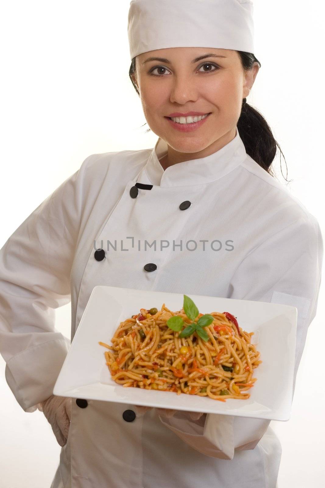 Chef holding plate of pasta