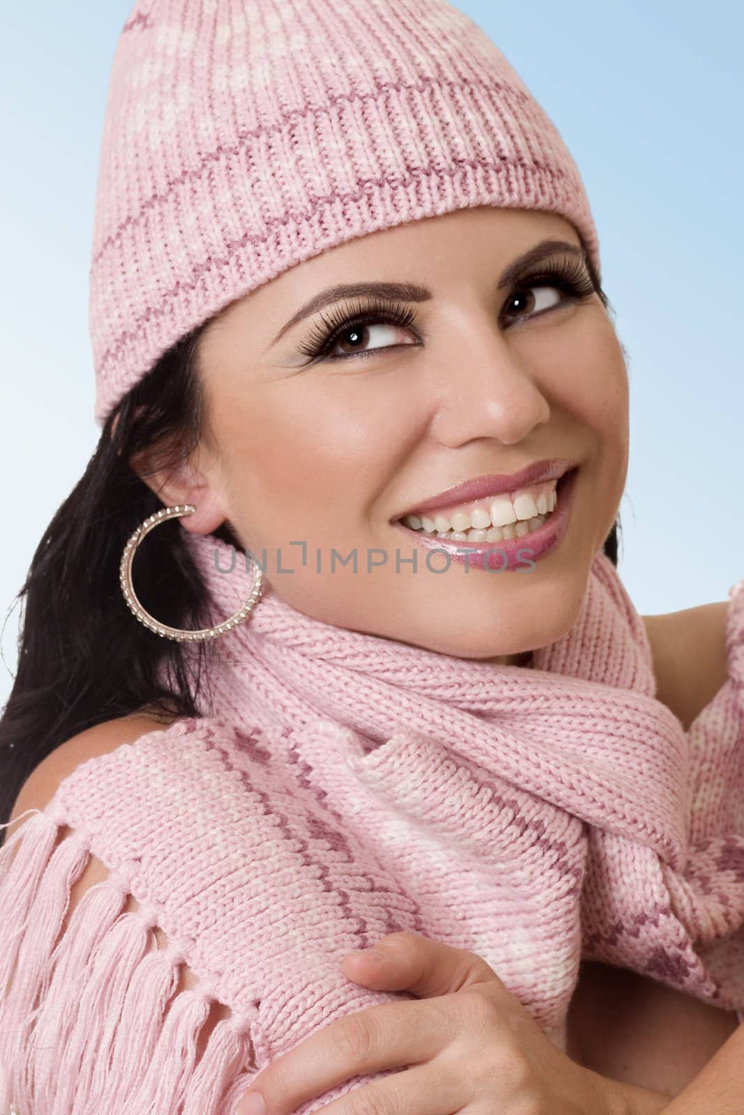 Attractive woman in cozy knits with a warm happy smile