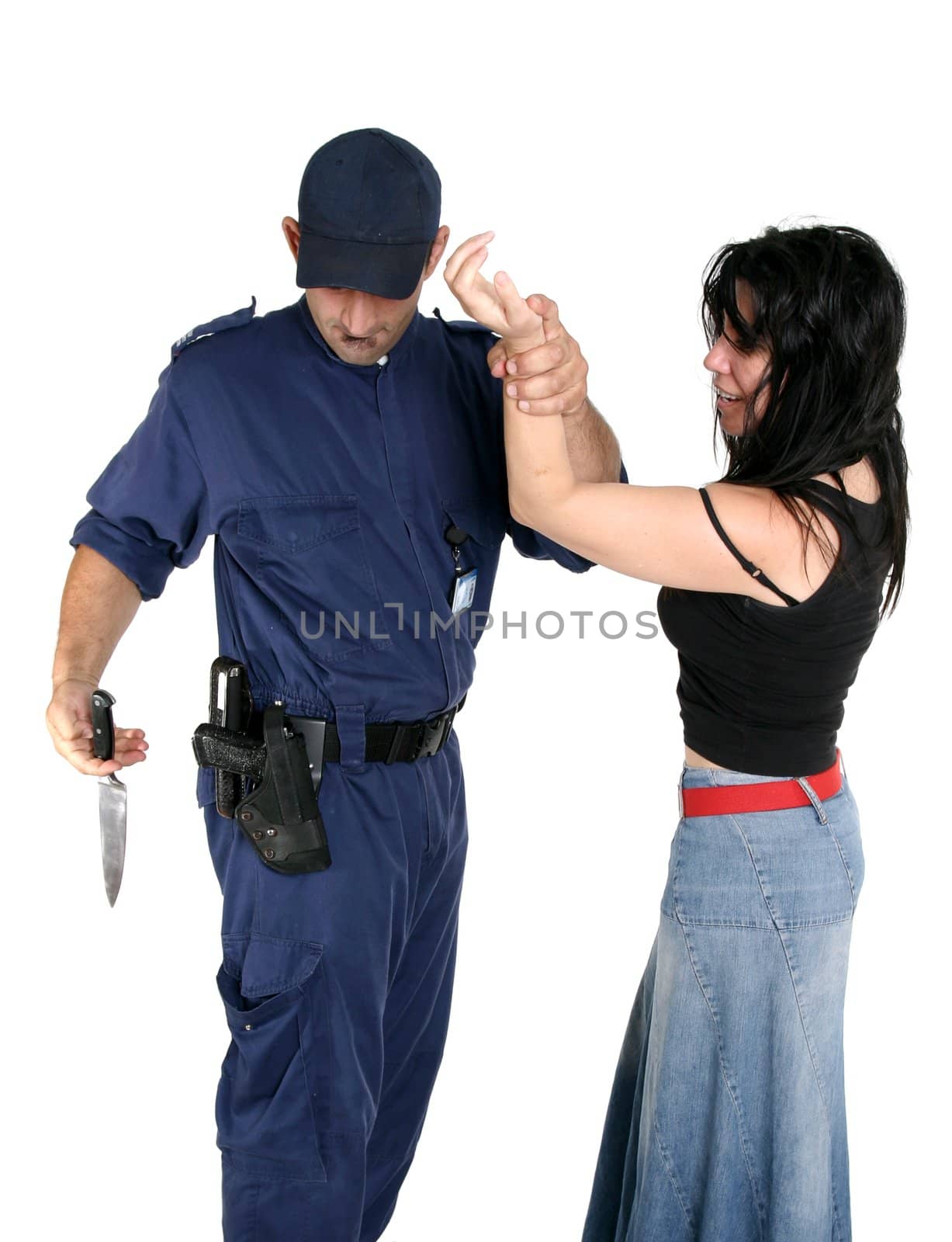 Officer apprehends and disarms a knife from a rough female criminal