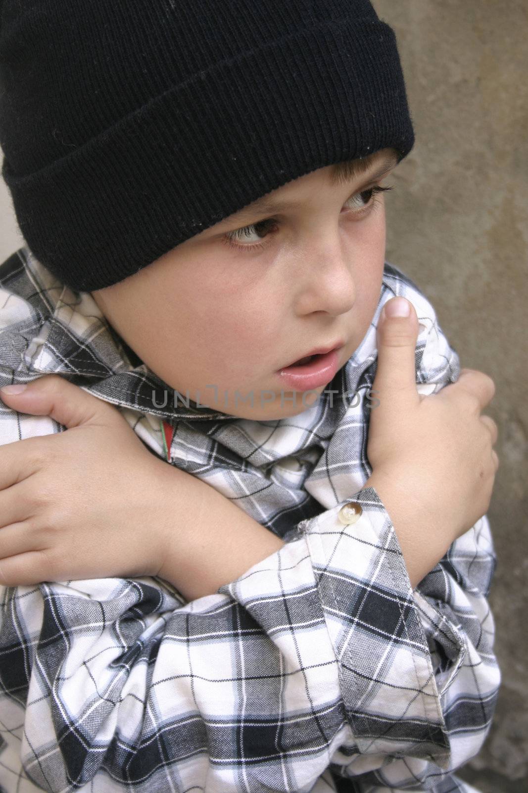 A homeless boy cold and lonely
Part of a kids on the street series.

