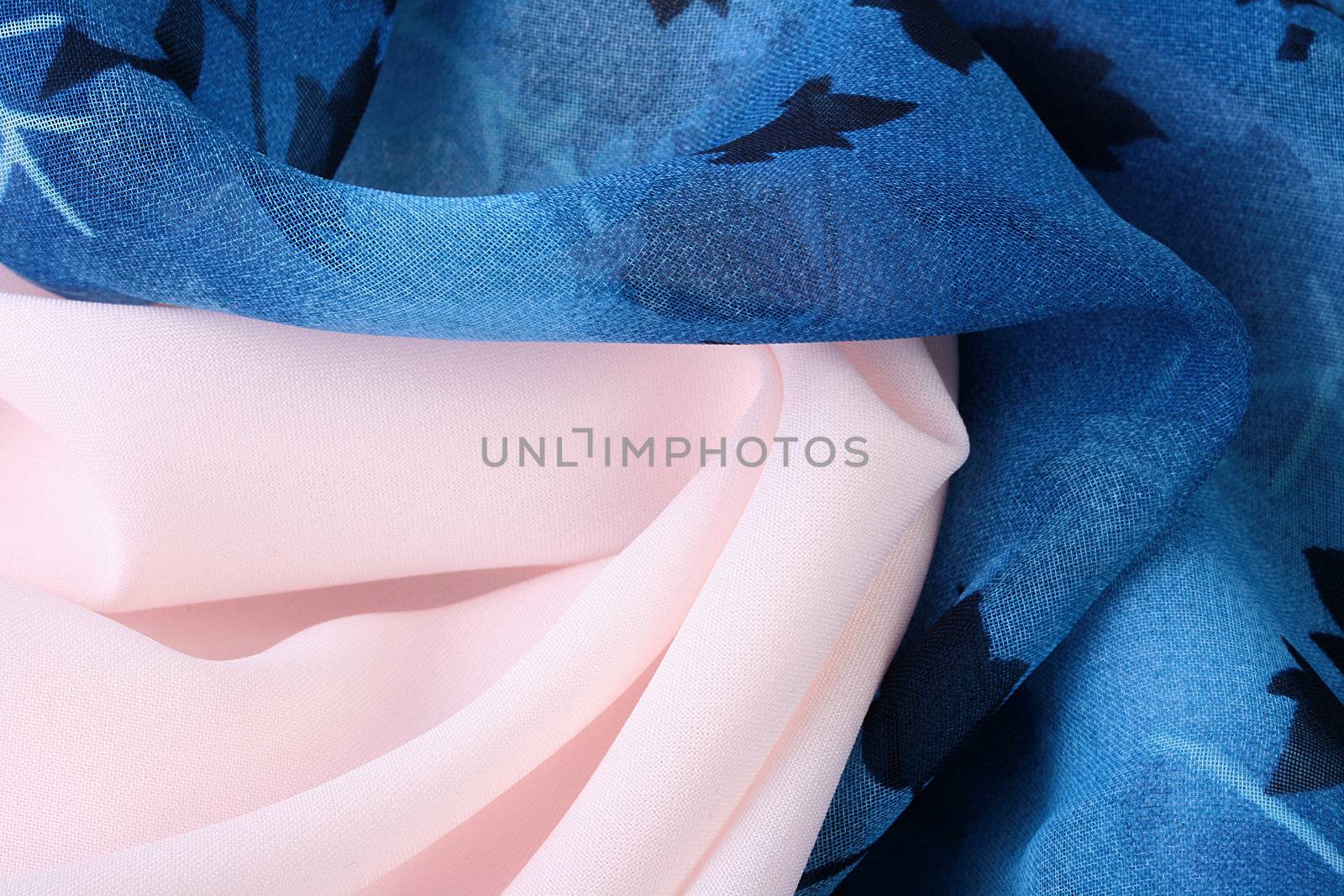 Two fabrics it is light pink and dark blue as a background.