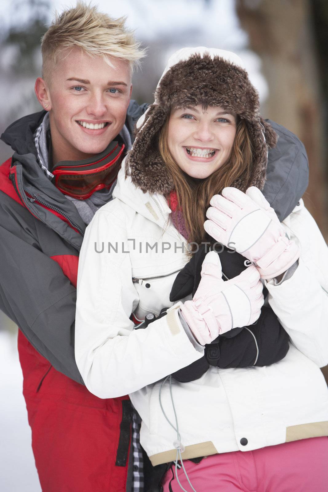 Romantic Teenage Couple In Snow by omg_images