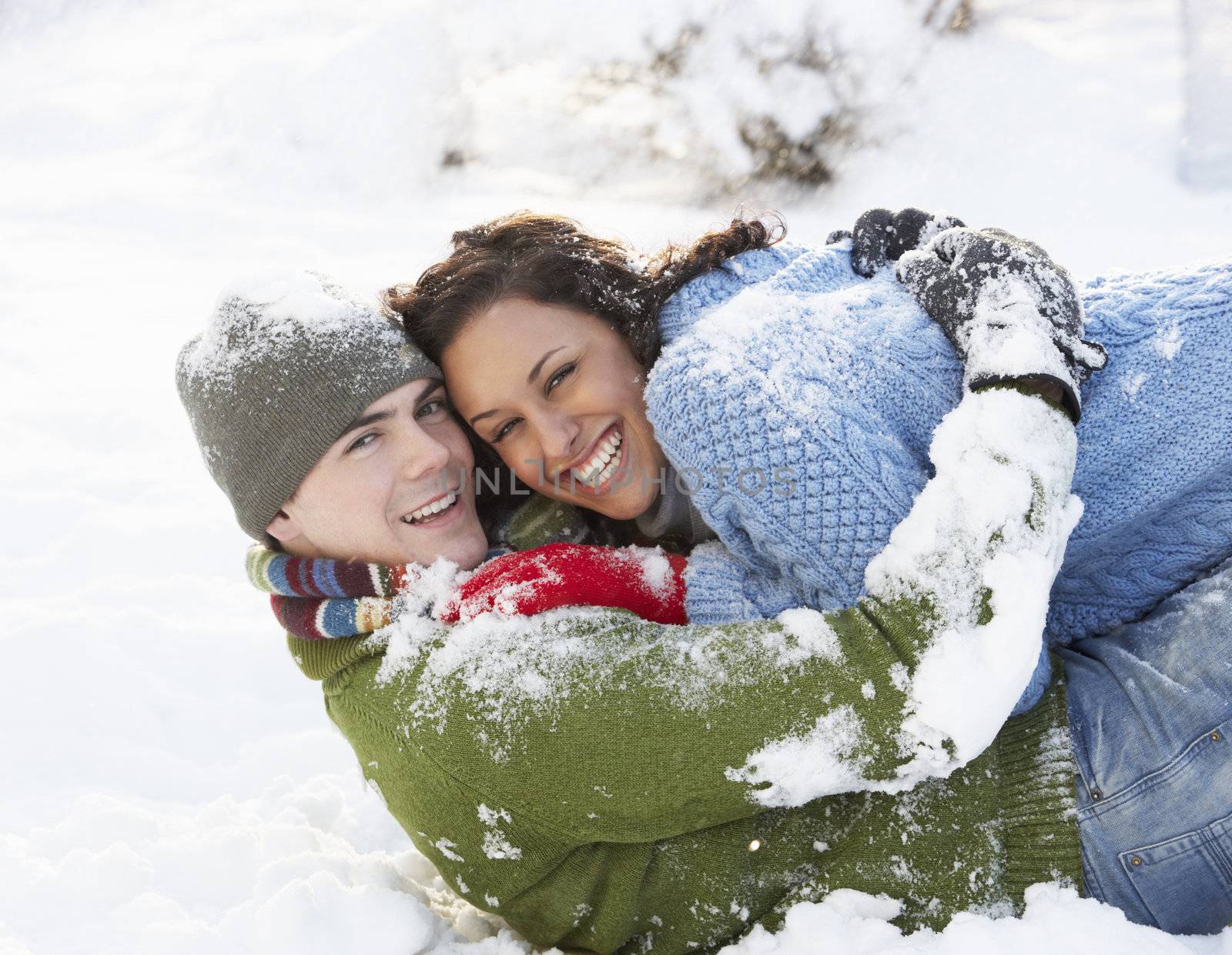 Romantic Couple Having Fun In Snow by omg_images