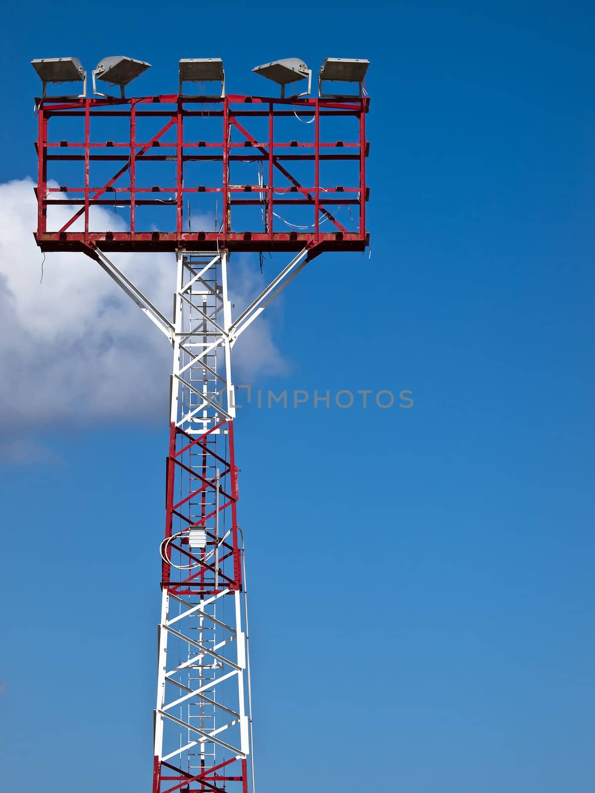 Airfield lighting tower against a clear blue sky