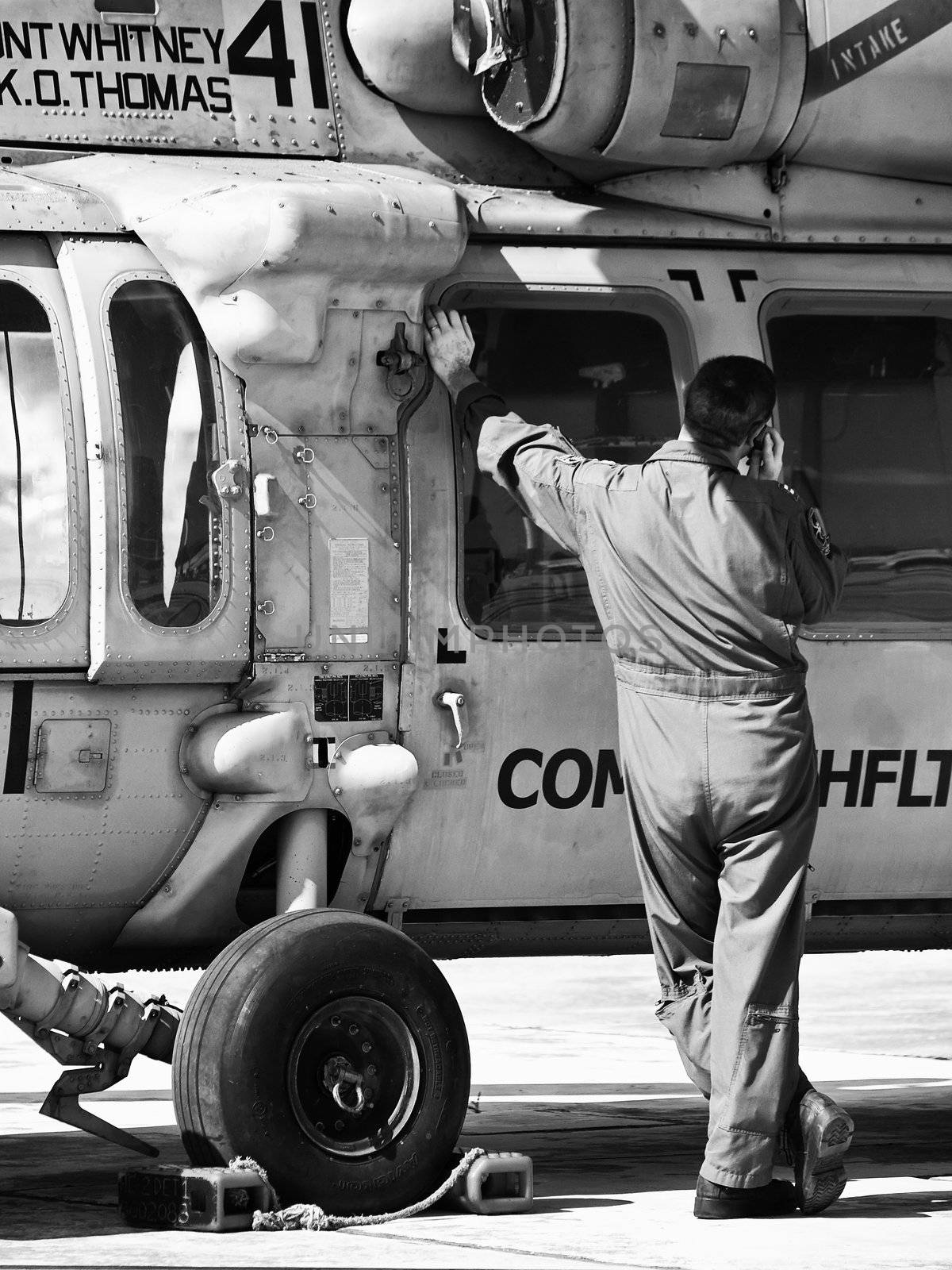 LUQA, MALTA - SEP 26 - Helicopter pilot speaking on cellphone during the Malta International Airshow 26th September 2009