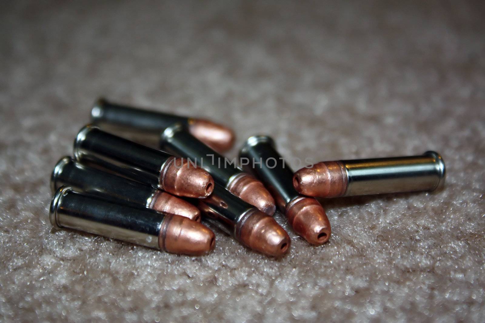 a small pile of shiny bullets