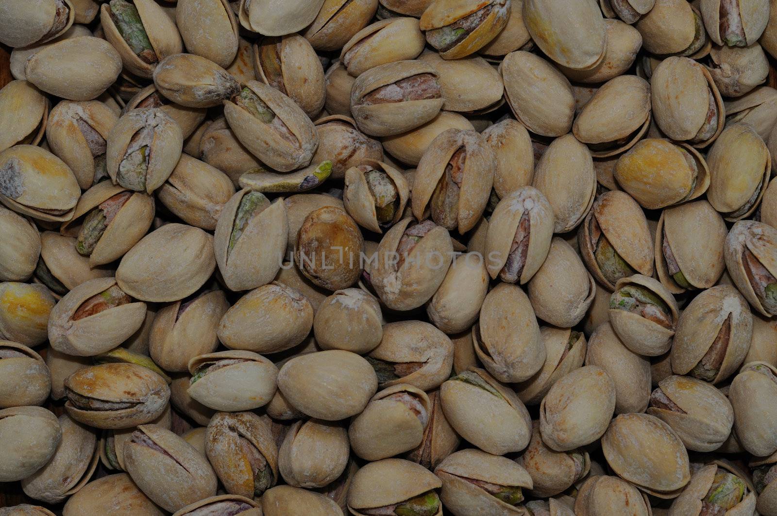 a bunch of pistachio nuts as an Abstract background texture