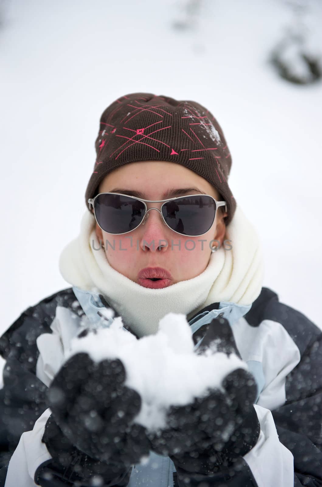 Pretty girl at the mountain in winter