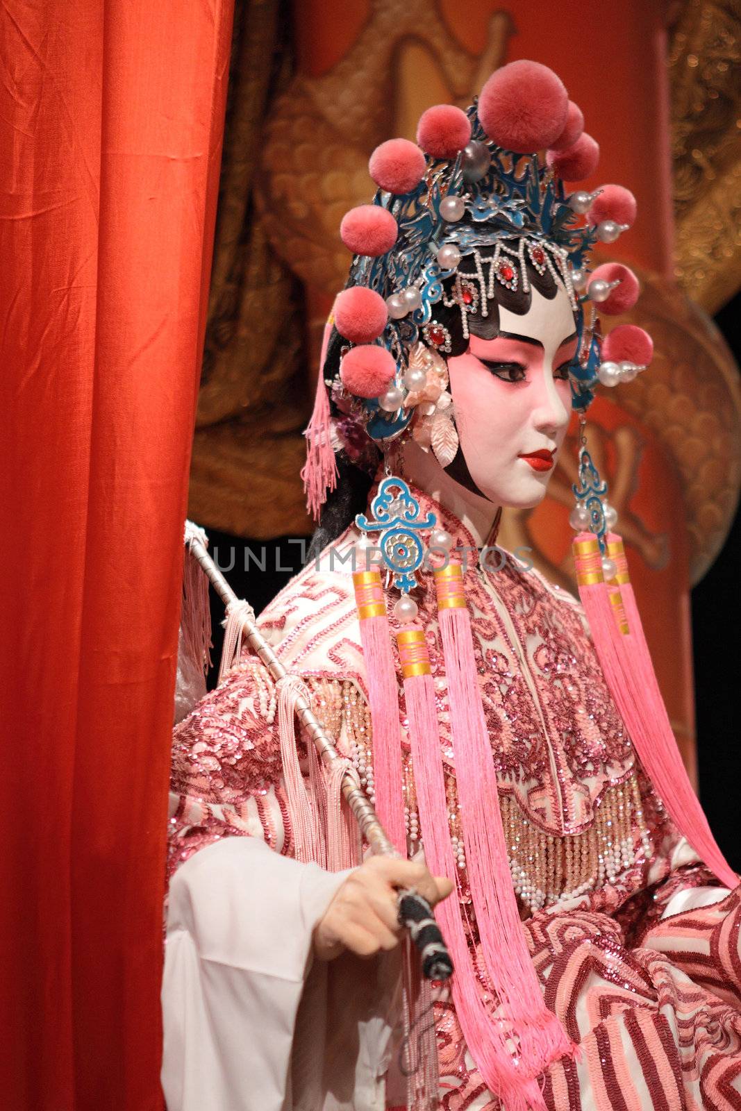 chinese opera dummy and red cloth as text space ,it is a toy,not real man 