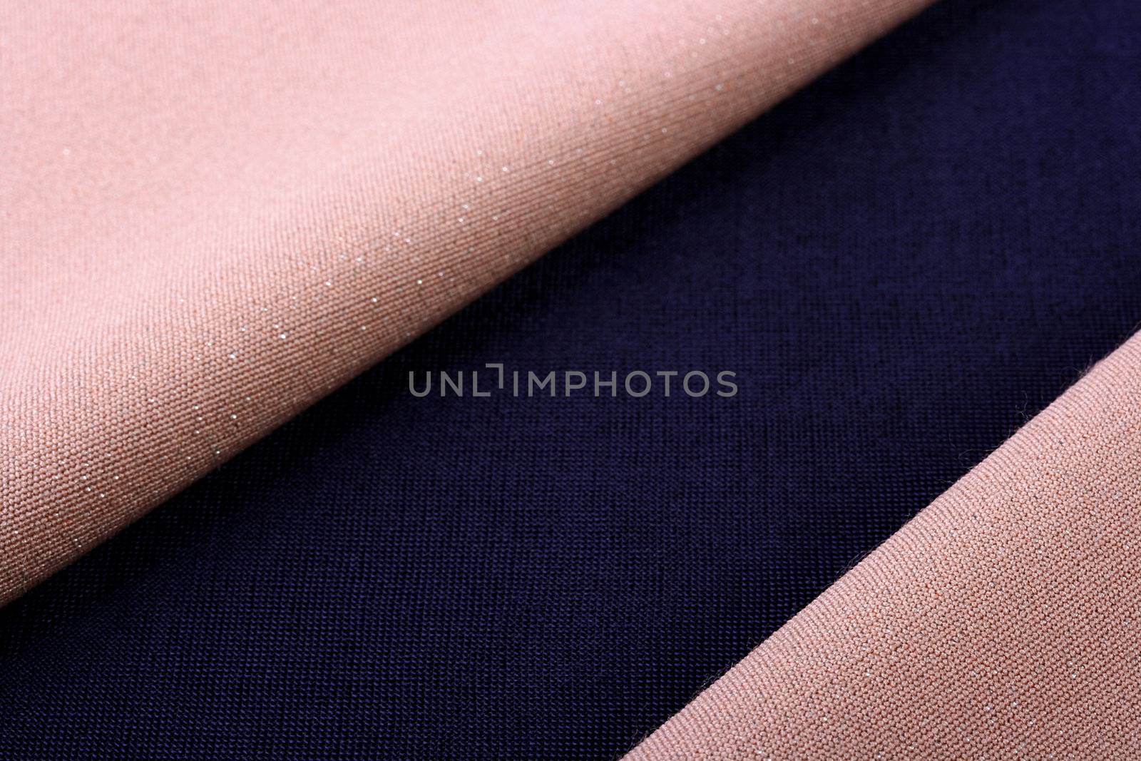 Beige and darkly dark blue fabric as a background for design works.