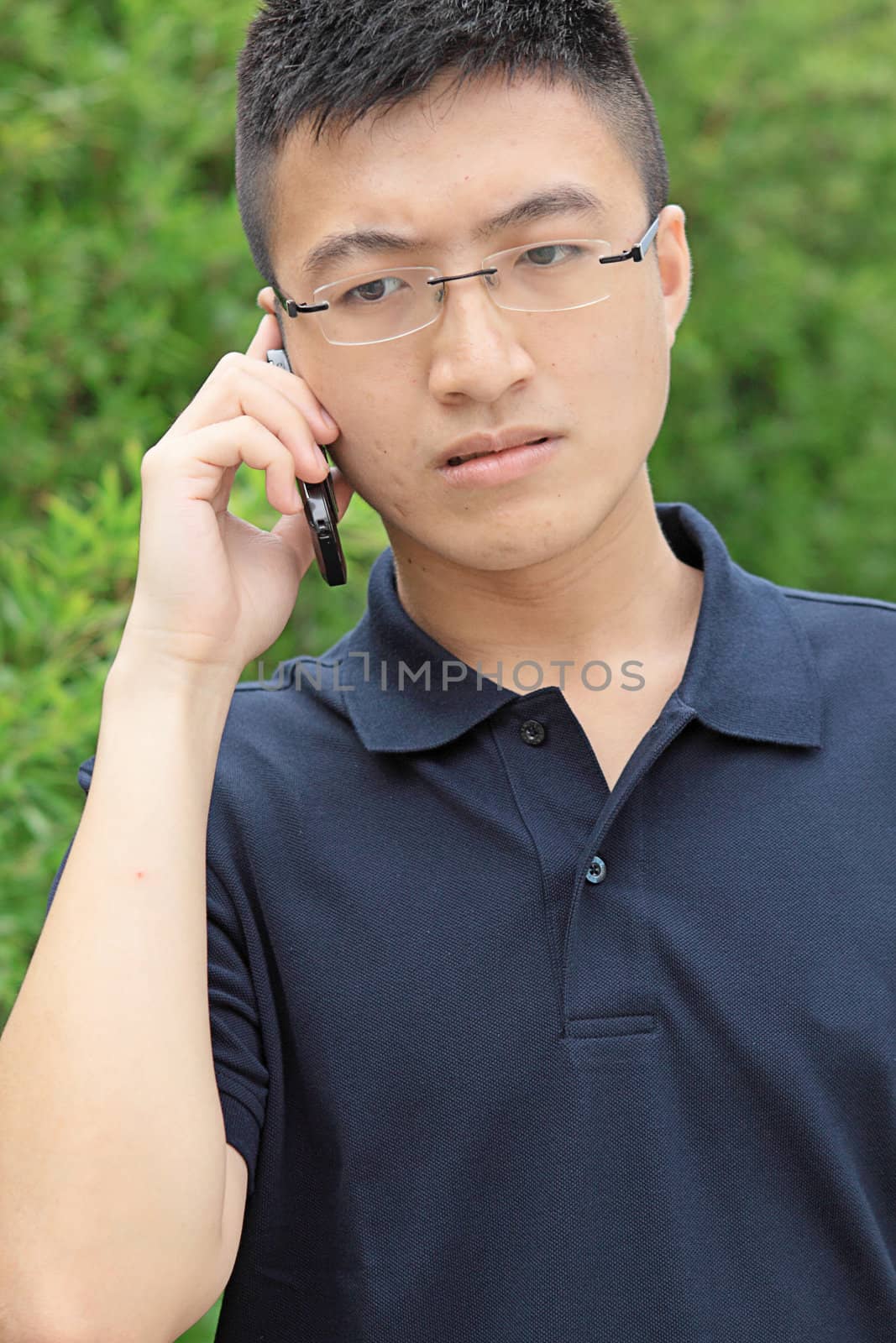 chinese man talking phone and worry by cozyta
