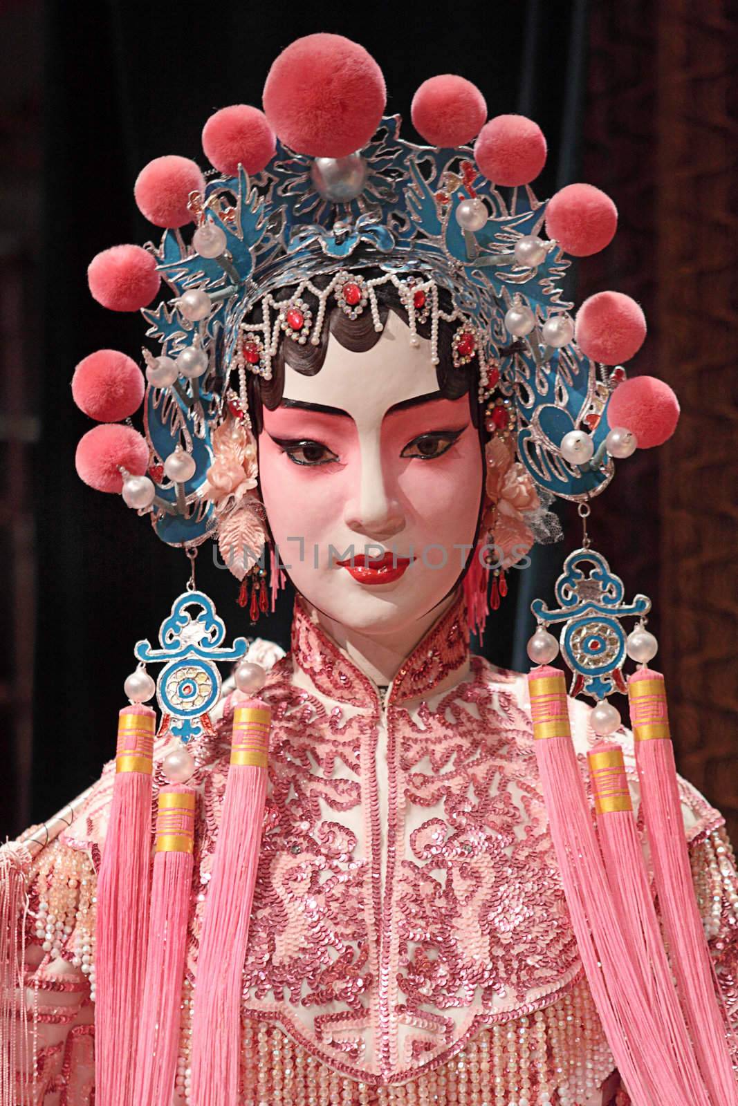 chinese opera dummy and red cloth as text space ,it is a toy,not real man 