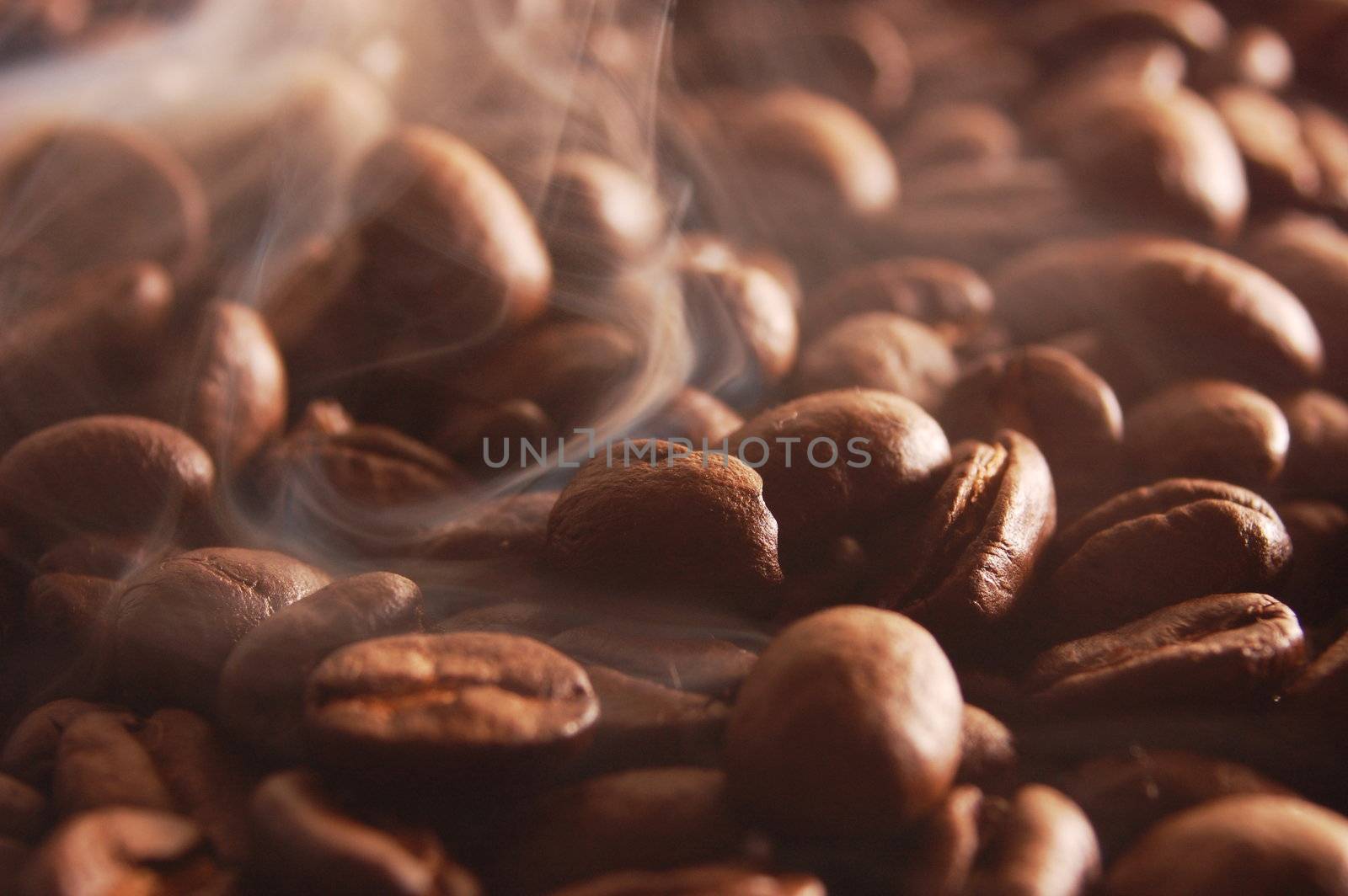 roasting coffee beans with smoke and steam