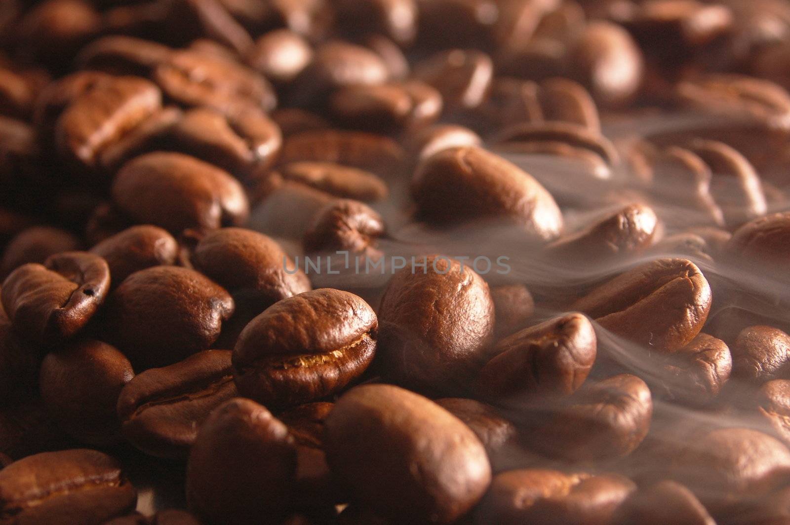 roasting coffee beans with steam and smoke