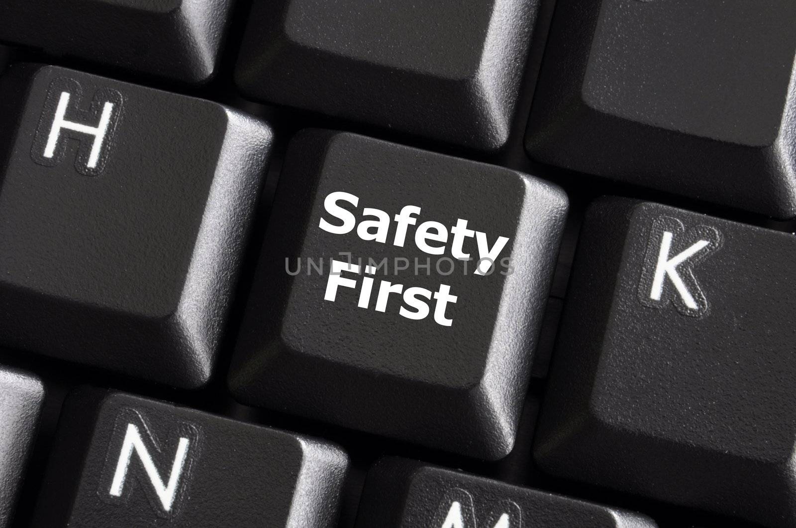 safety first concept with key on computer keyboard