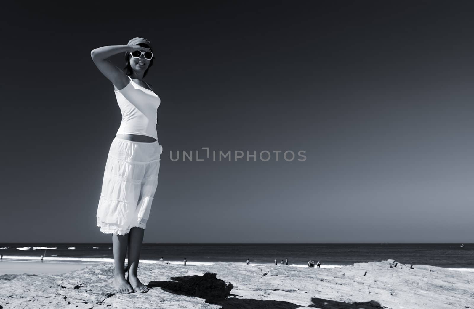 Woman in a beautiful morning on the beach (toned in PS)