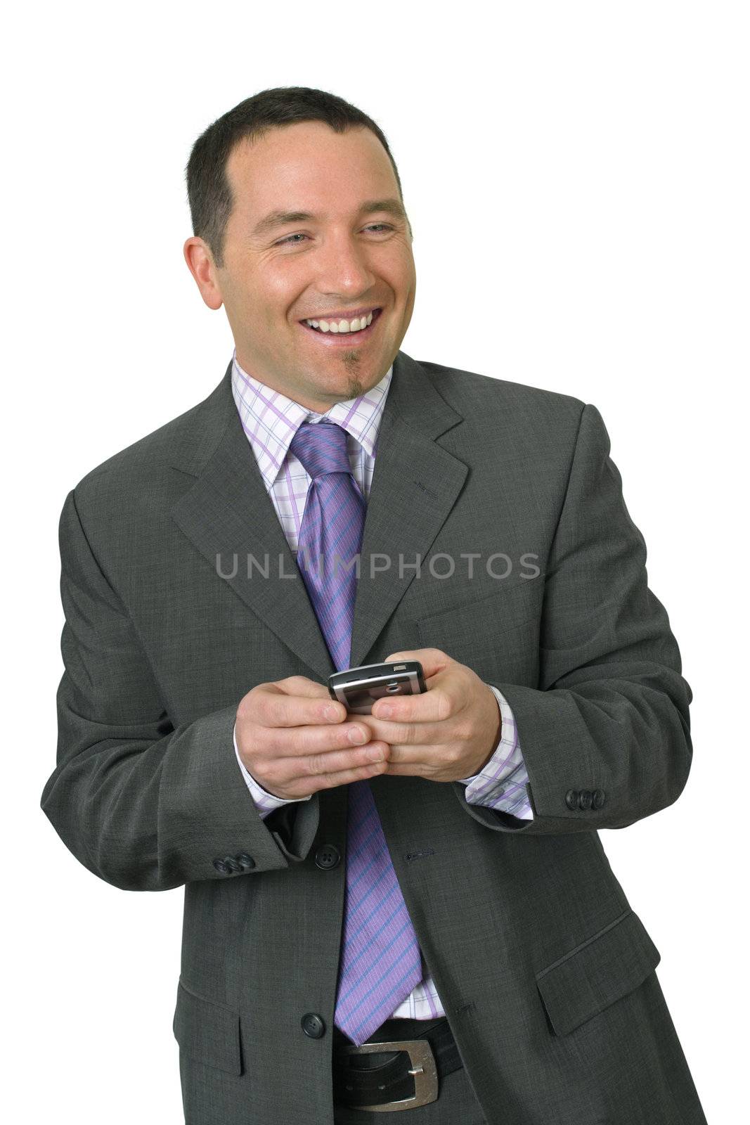 Friendly attractive businessman in his thirties smiling while using his PDA
