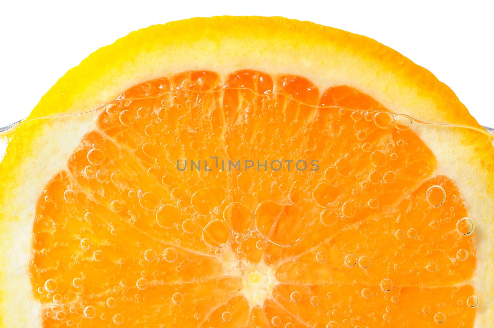 Orange slice in water by elenathewise
