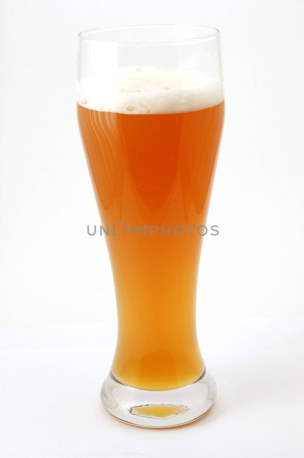 glass of german beer with foam foam and bubbles
