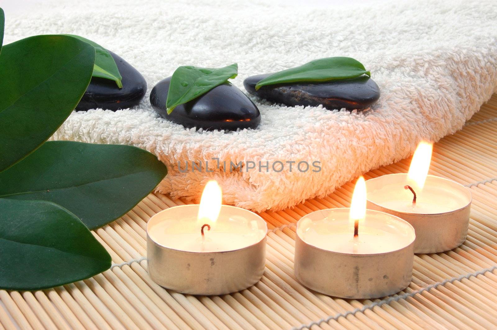 towel and zen stones showing a bath or wellness concept
