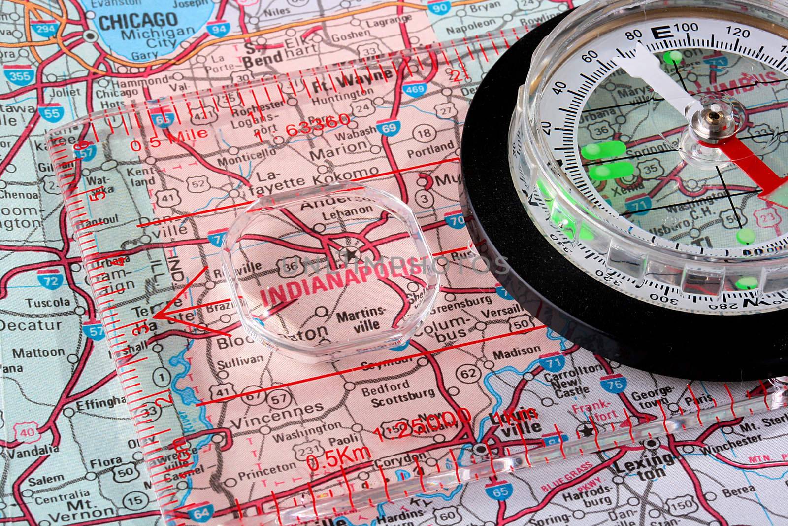 USA map with the city of Indianapolis and a compass with magnifying glass over Indianapolis.