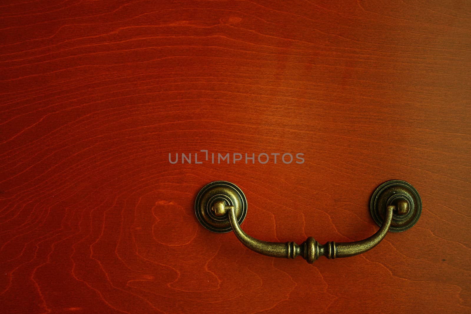 The ancient handle on a case door, as an element of design of an interior of apartment.