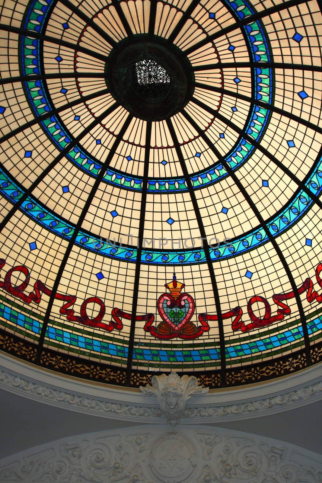 stained glass display with plaster crown moulding on interior of castle or mansion