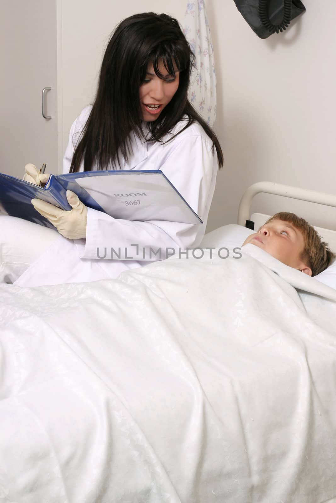 Doctor with child in hospital by lovleah