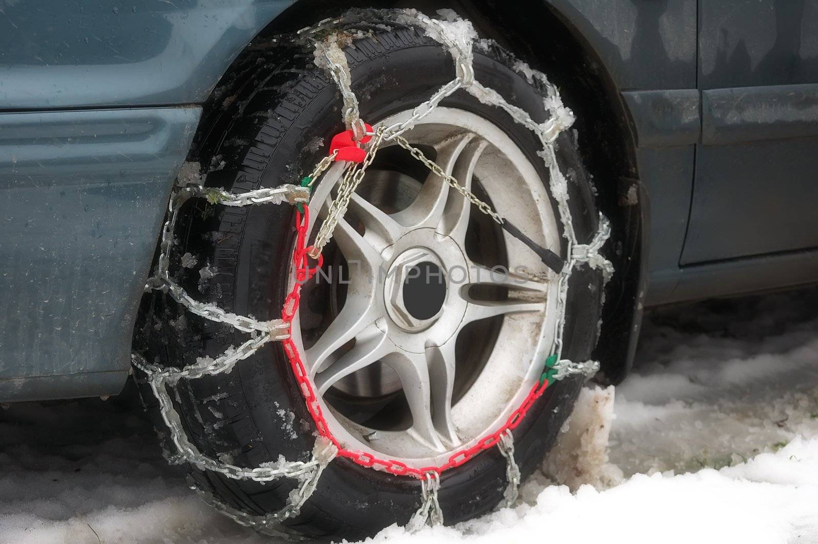 winter chains of anti-skid on a motor-car wheel