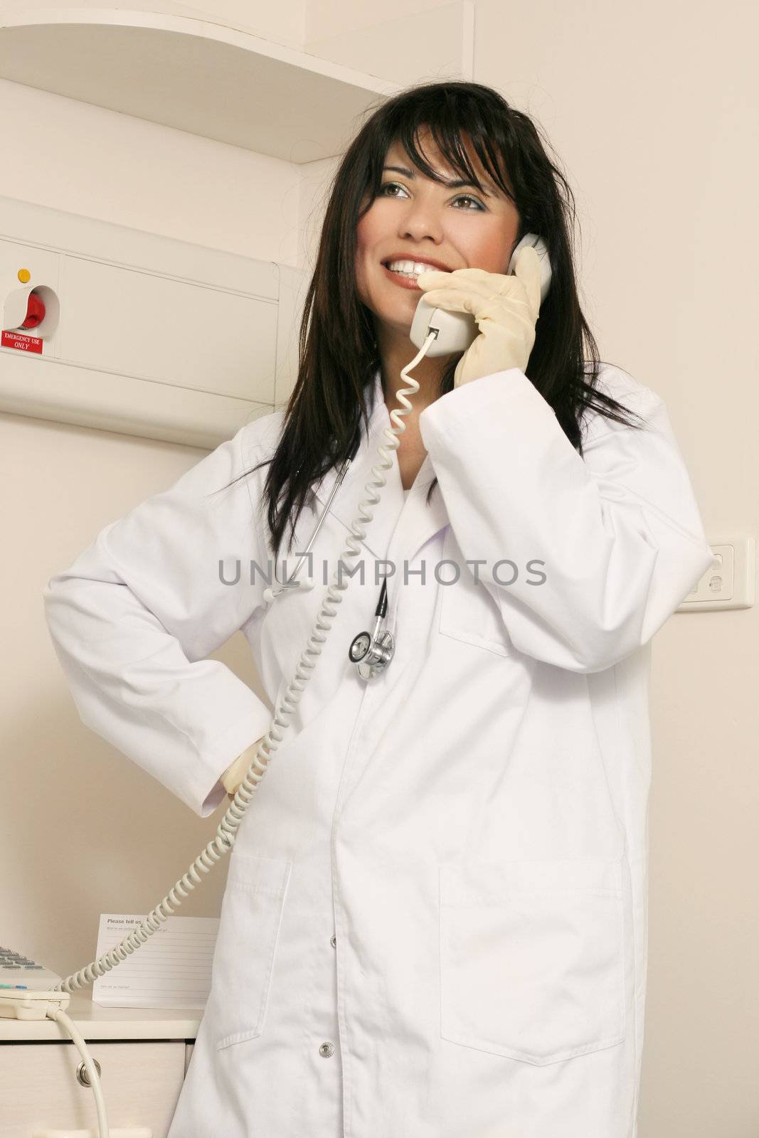 Medical staffer on duty takes a phone call
