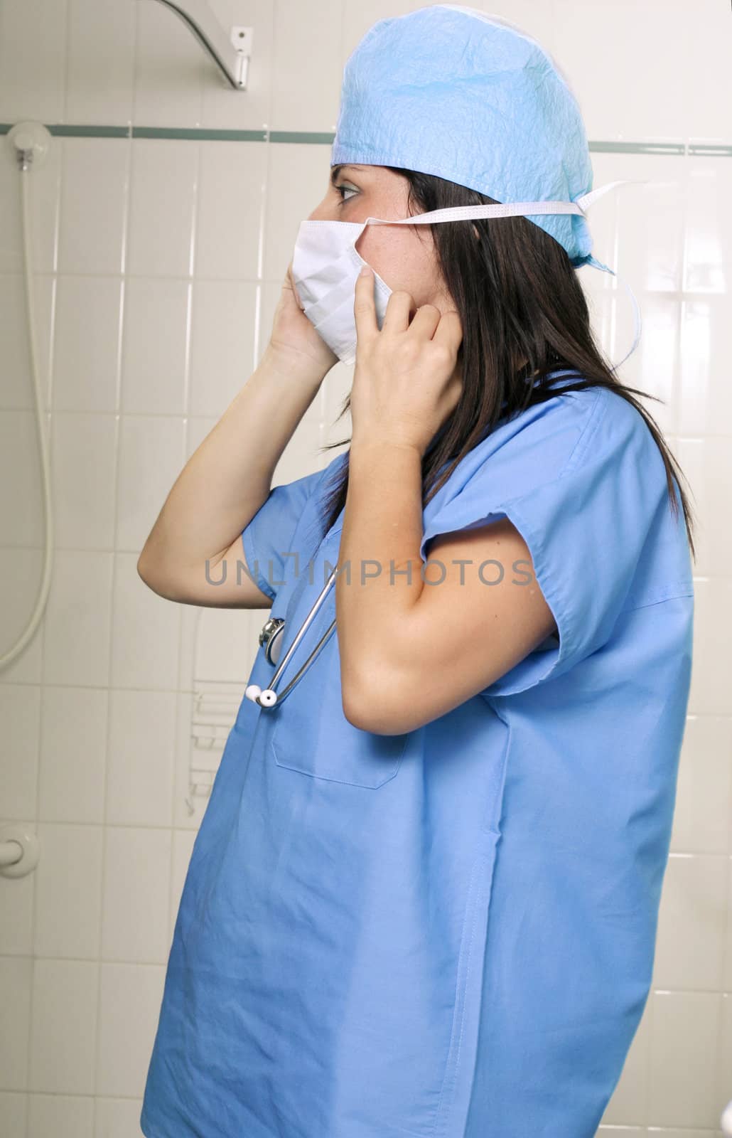A surgeon getting ready
