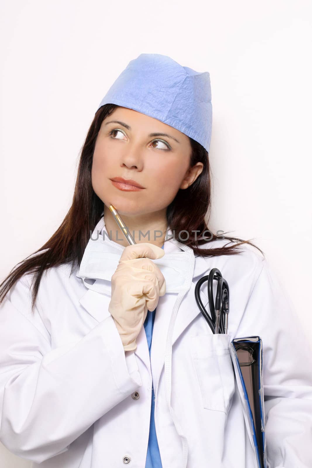 Healthcare worker in scrubs uniform and doctor coat.
