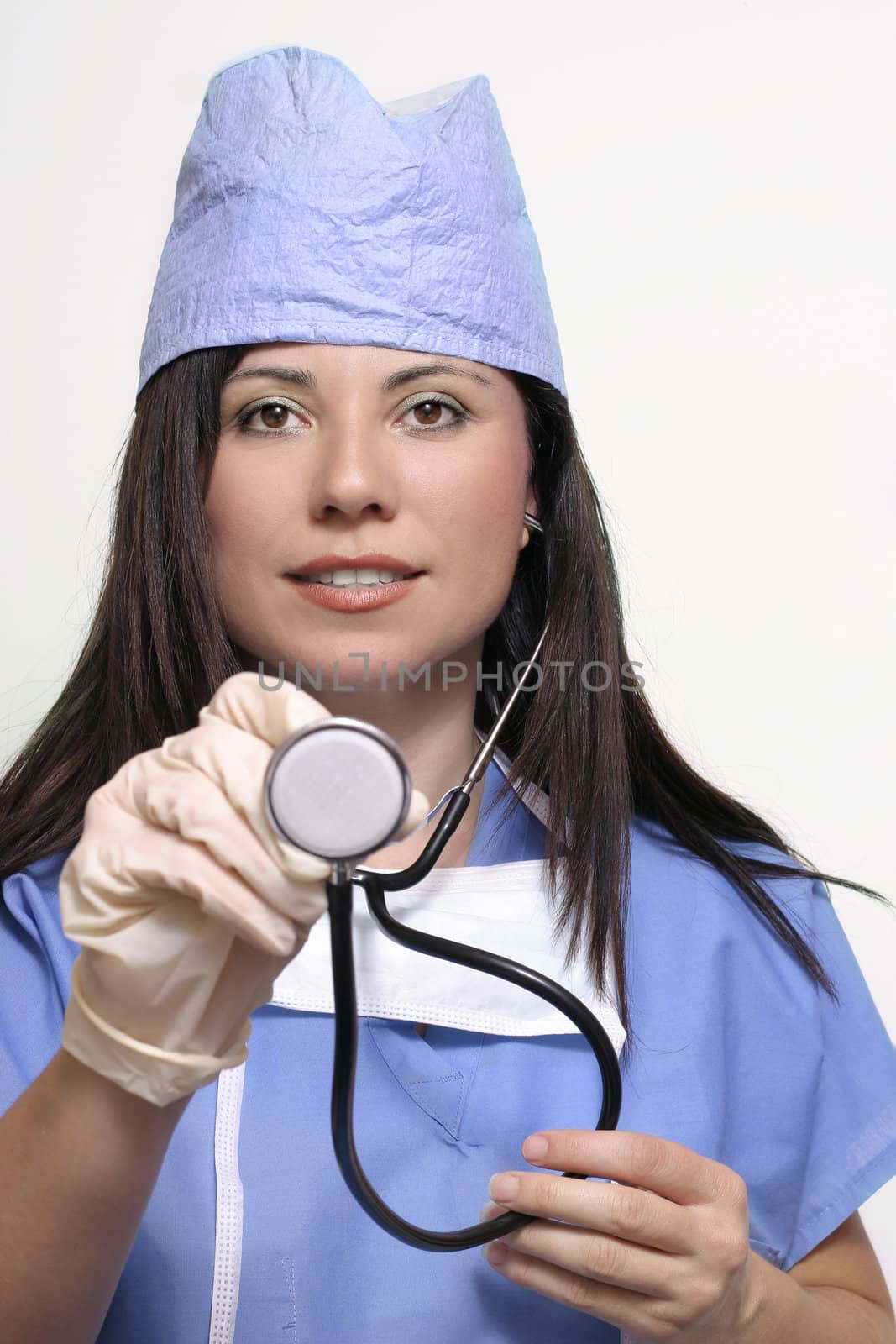 Female  nurse extending a stethoscope
