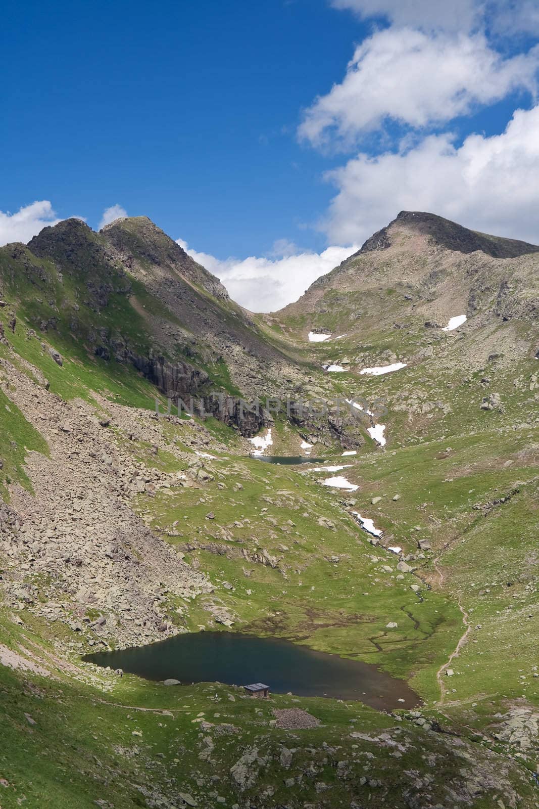 summer view of Lusia lakes, in val di Fassa, Italian dolomites. Photo taken with polarized filter