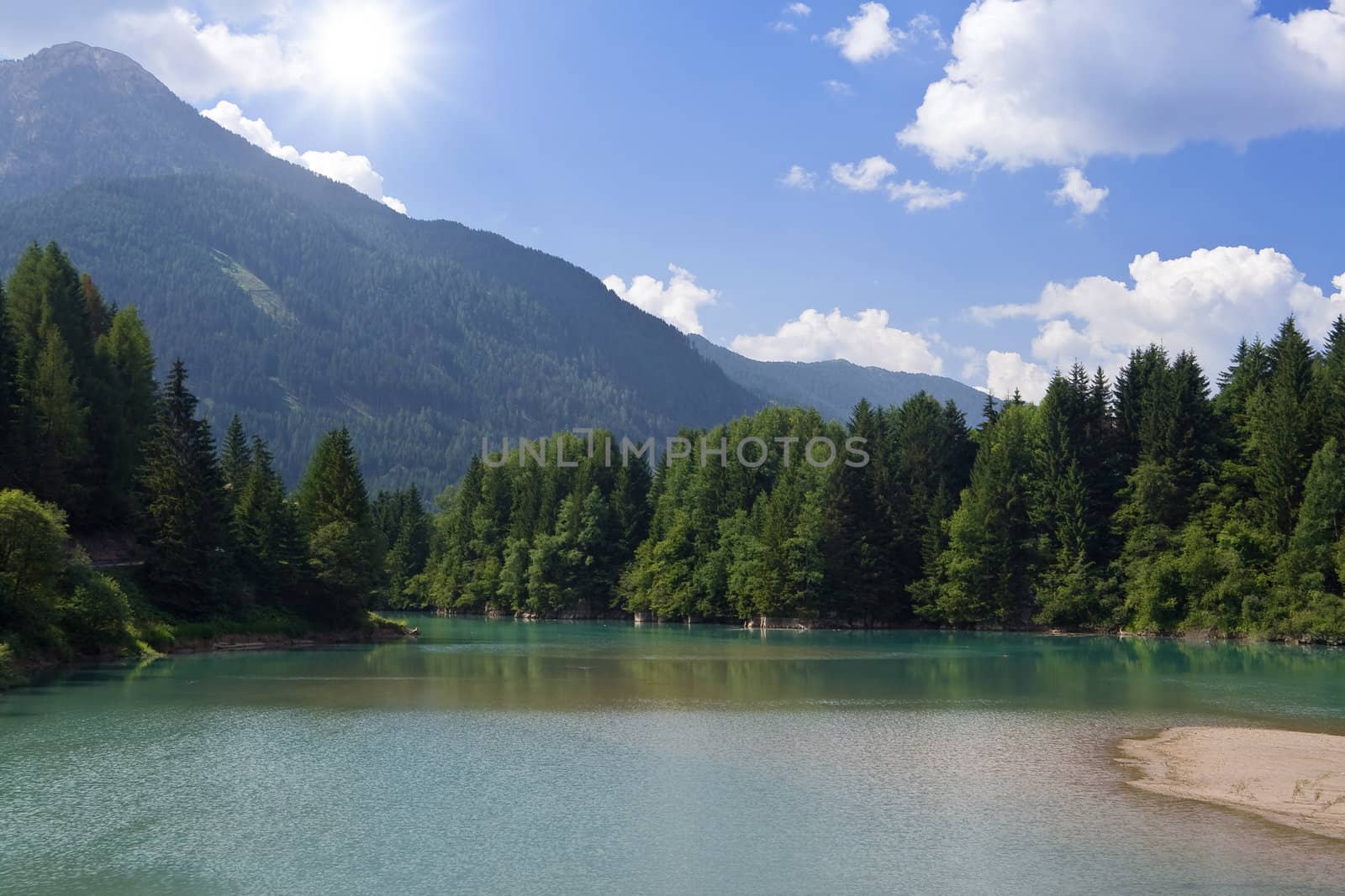 Summer view of Soraga lake in Val di fassa Trentino Italy