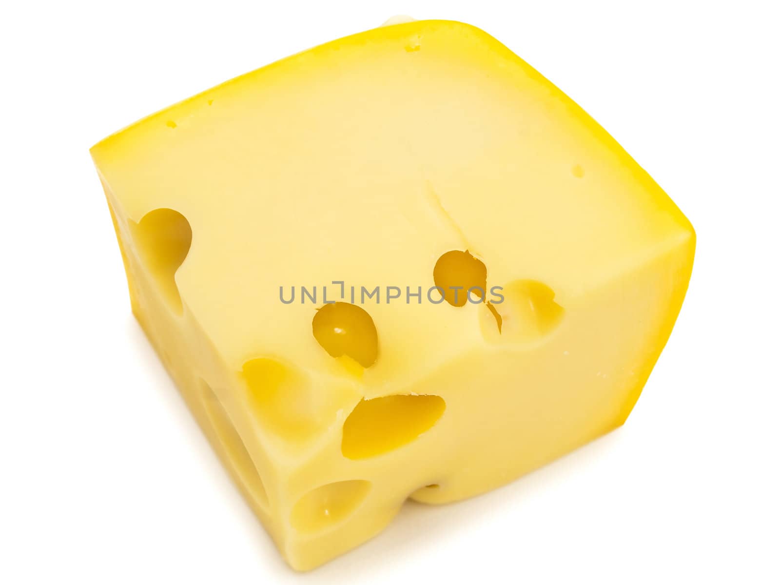 close up photo of the tasty yellow piece of cheese against the white background