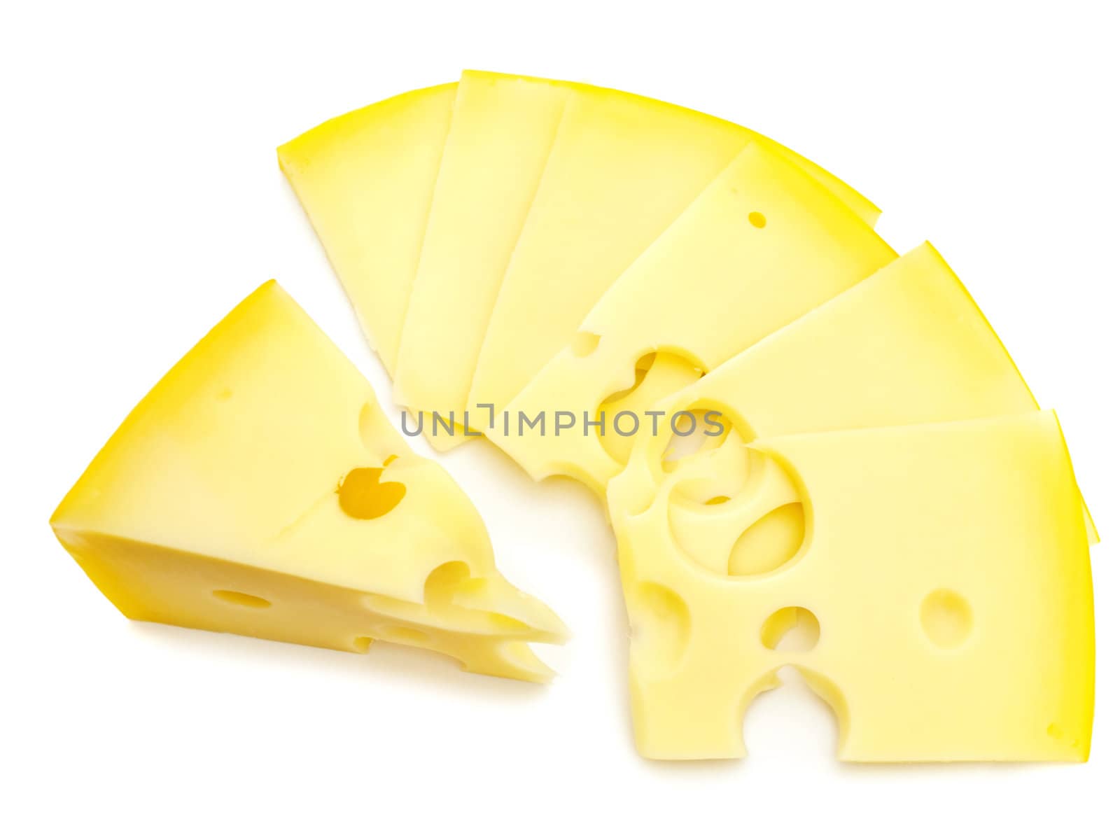 close up photo of the tasty yellow pieces of cheese against the white background