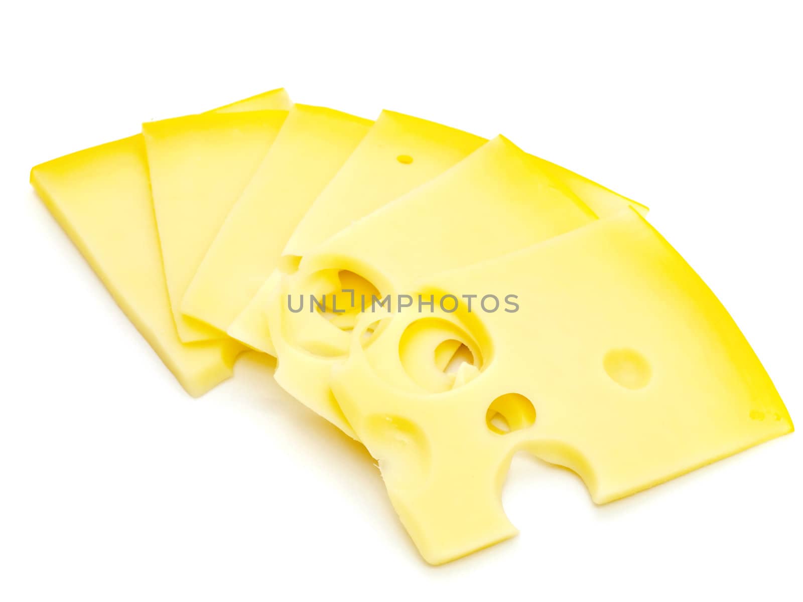 photo of the tasty yellow pieces of cheese against the white background