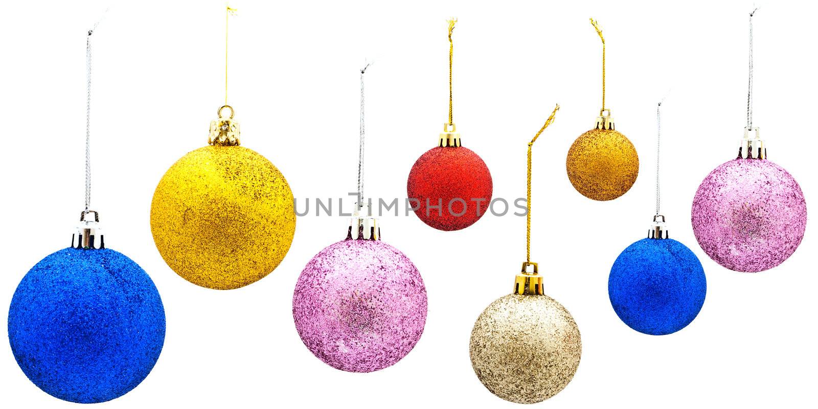 Bright multicolored New Year toys against the white background