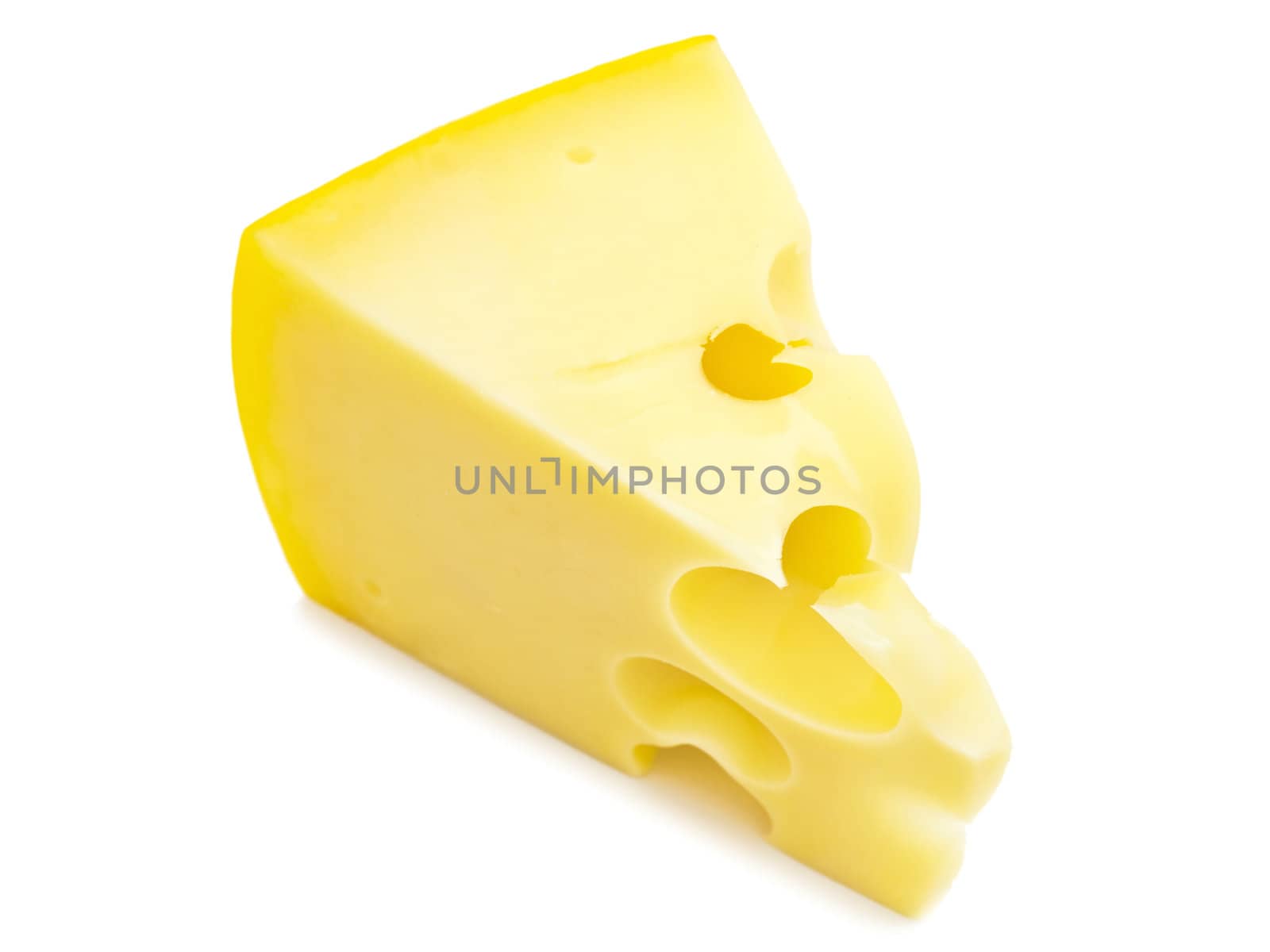 tasty yellow piece of cheese against the white background 