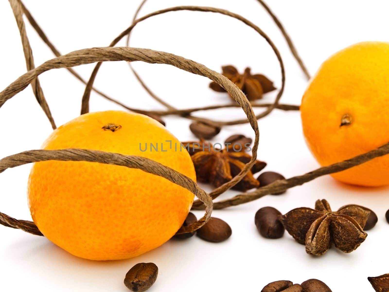 mandarines with decorations of anise stars, coffie and cord
