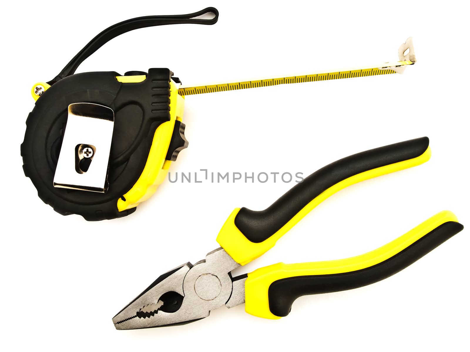 tapeline and pliers against the white background 