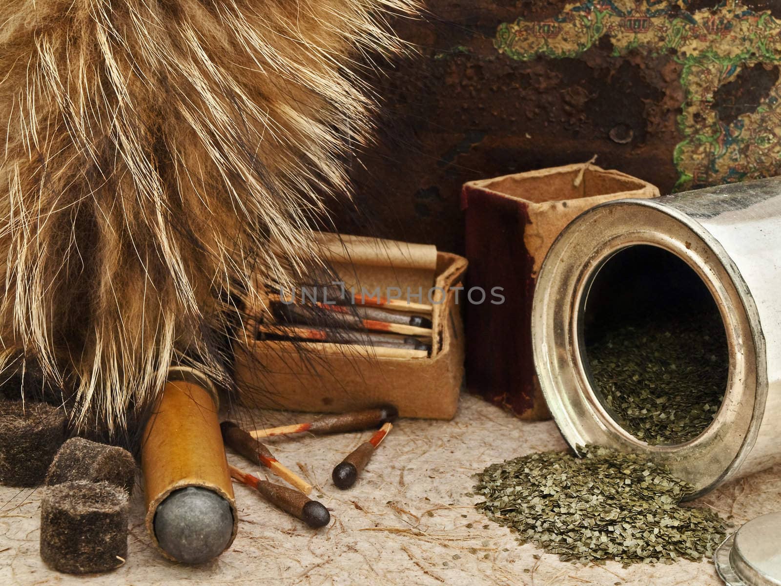 Photo of old matches for hunting with fox brush and gunpowder at beige 