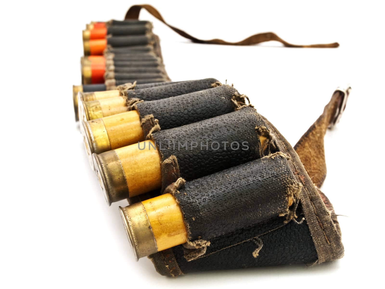 Photo of old cartridge in leather belt for hunting rifle against white background