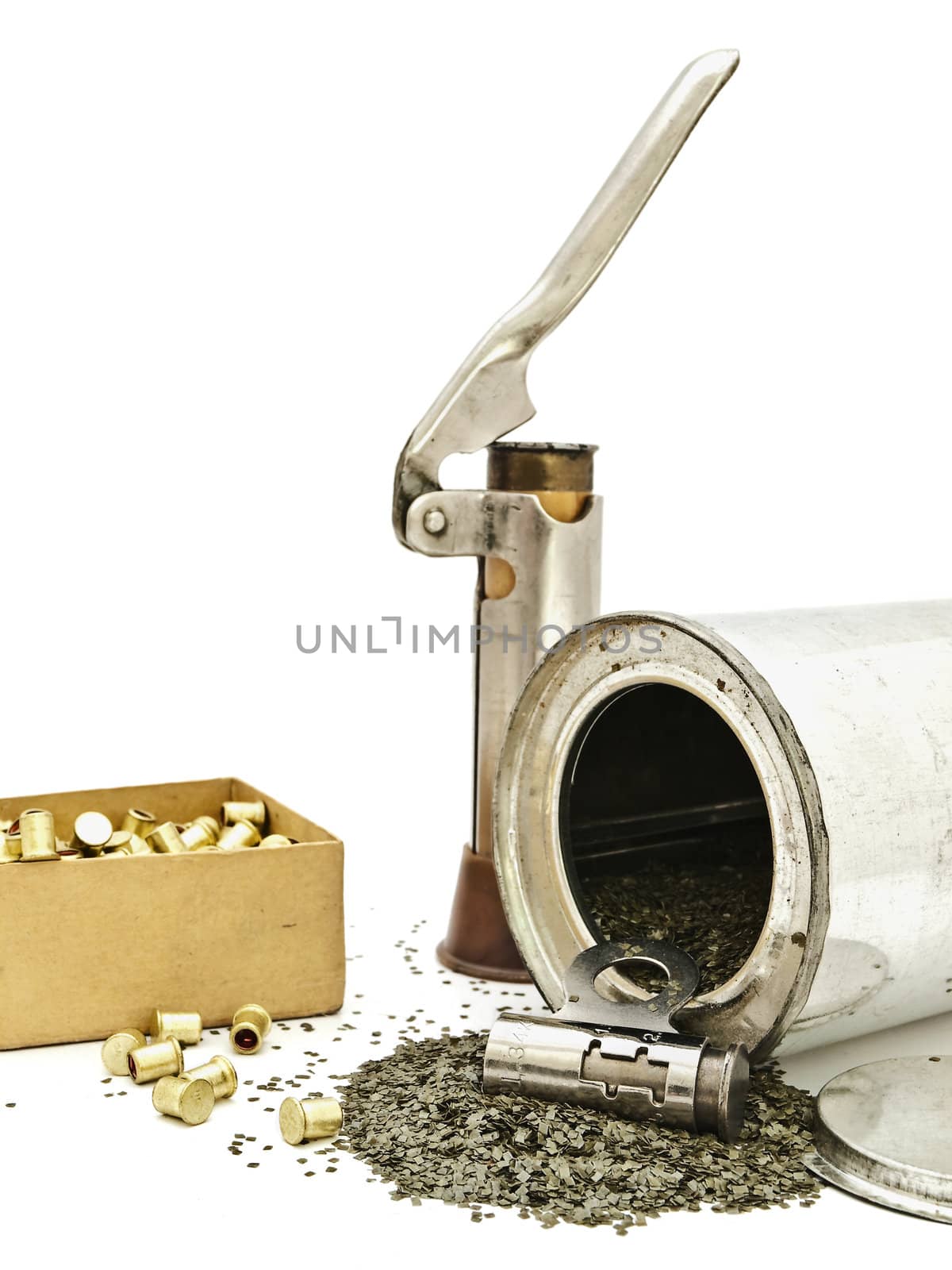 scattered gunpowder and hunting accessories against white background